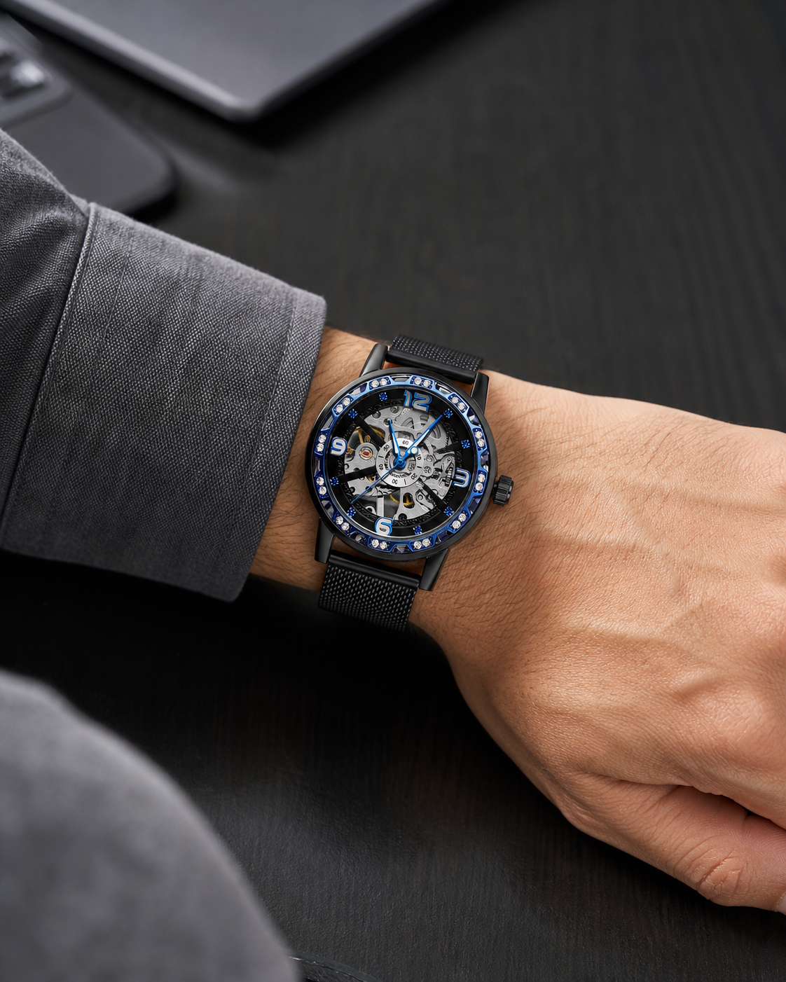 FORSINING 614 M4T4 on-wrist image, black mesh bracelet and blue skeleton dial