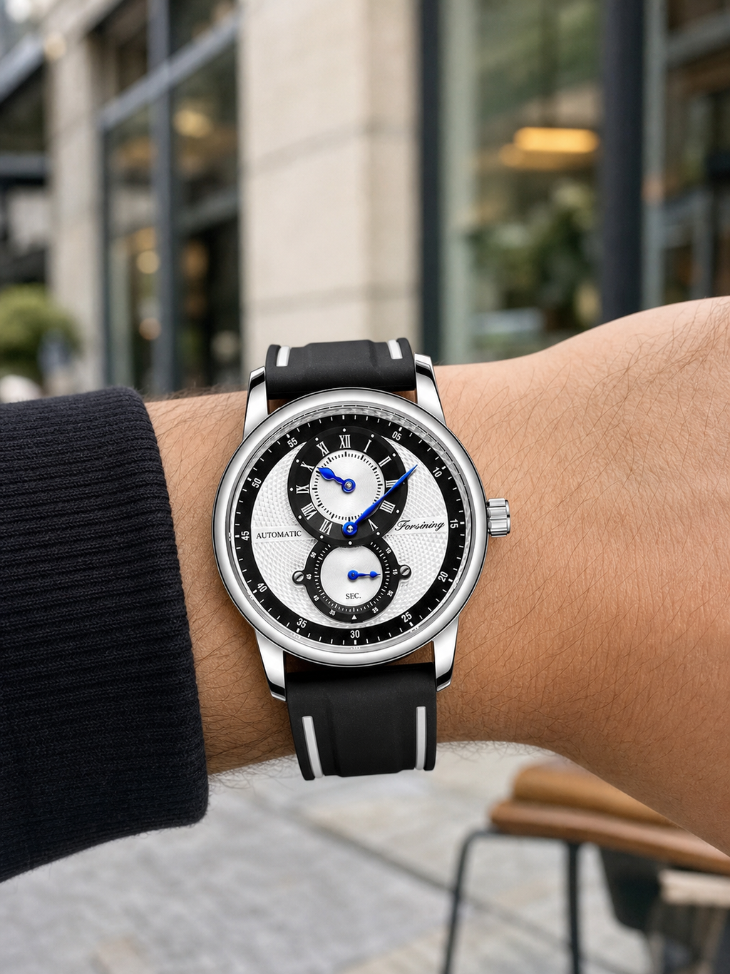 FORSINING 43mm Black / White automatic sport watch worn in a modern city setting