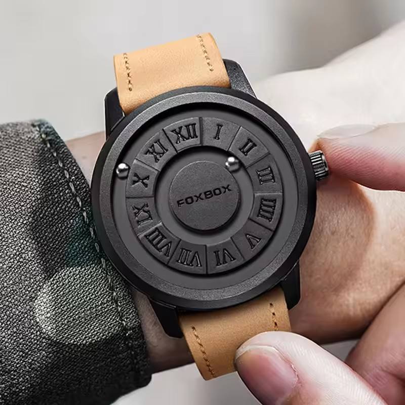Black magnetic ball watch with yellow leather band worn on wrist
