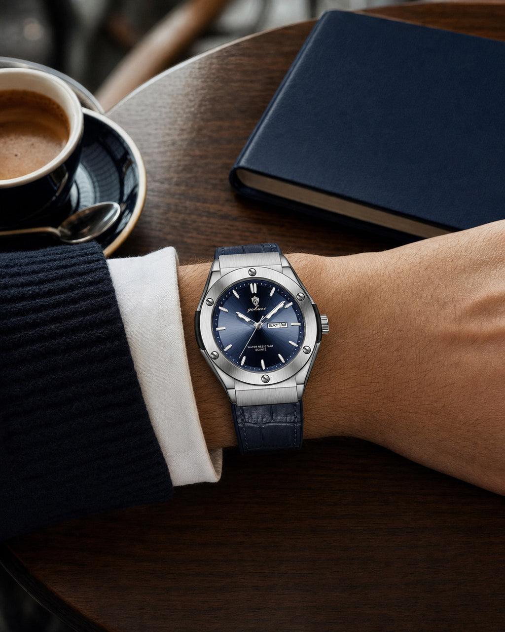 GOHUOS 8820 sunray day-date watch, blue dial, worn at a cafe table