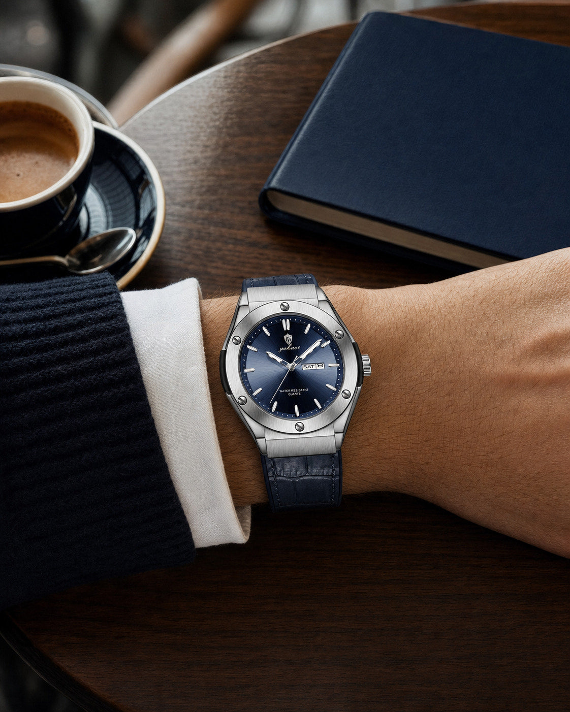 GOHUOS 8820 sunray day-date watch, blue dial, worn at a cafe table