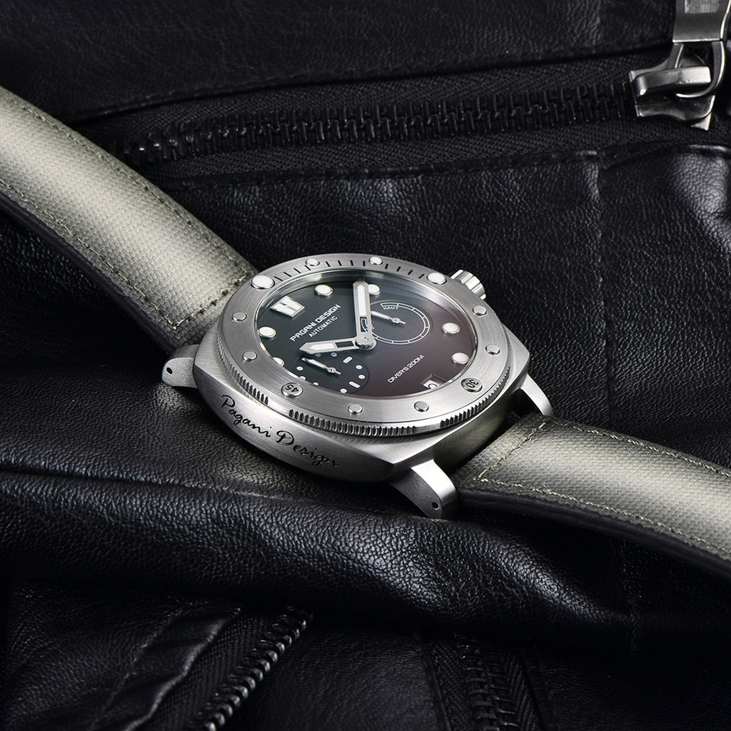 Pagani Design gray-dial automatic watch resting on a black leather jacket