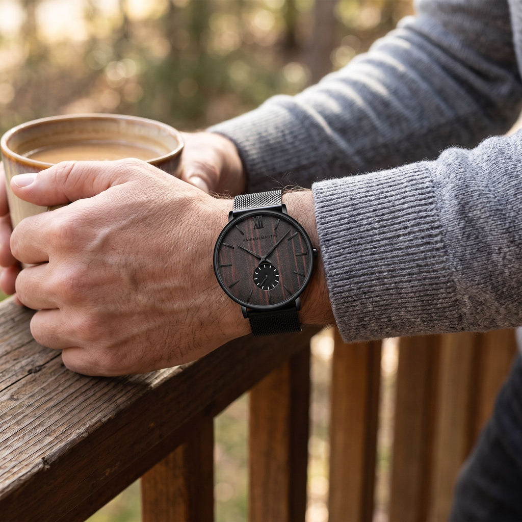 HANNAH MARTIN 3D Wood Stripe 40mm with dark wood dial worn on the wrist holding a coffee mug outdoors