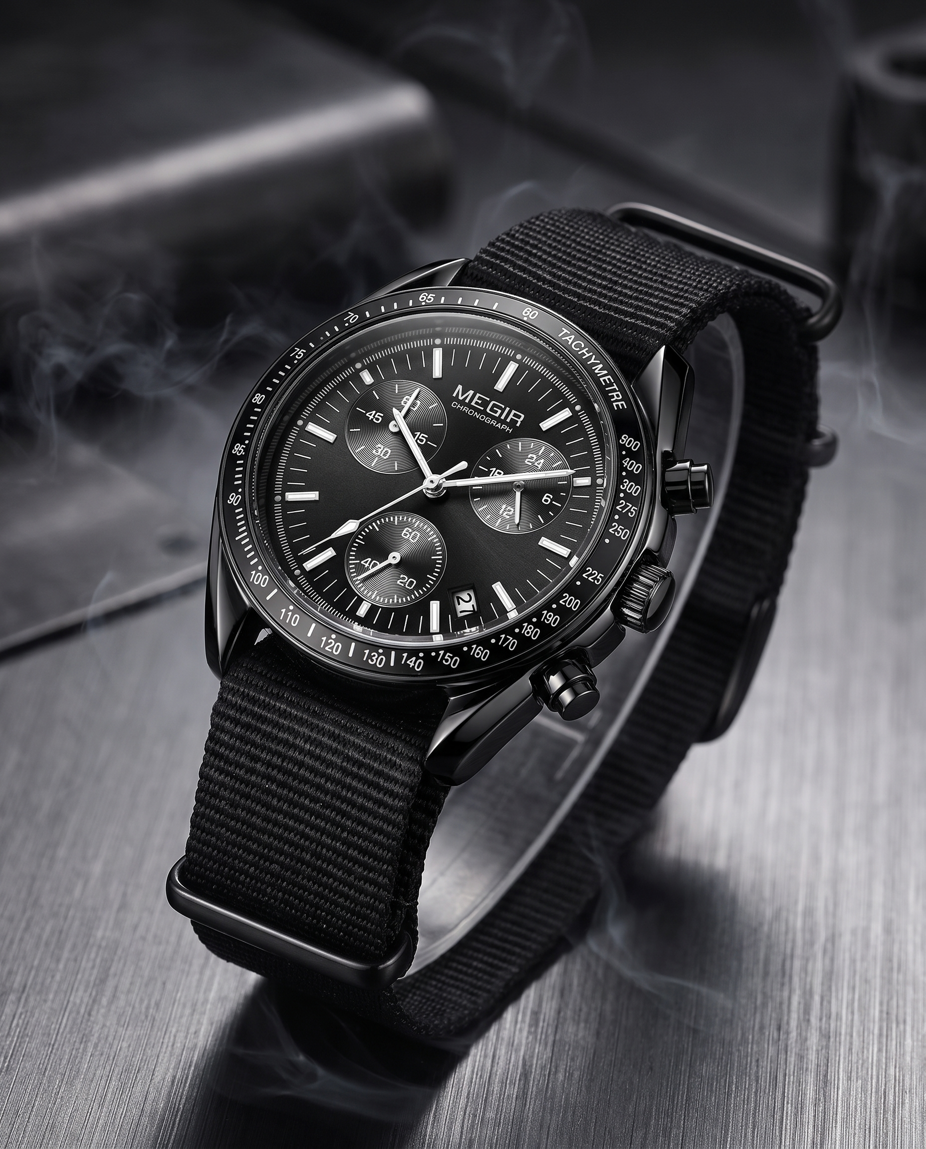 MEGIR 2247 black chronograph lifestyle shot on brushed metal, moody lighting