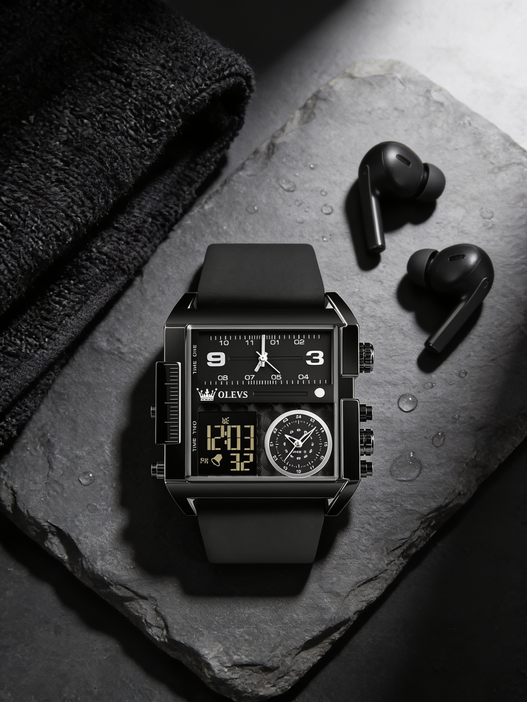 OLEVS 1101 black square analog-digital watch flat-lay on slate with gym towel and earbuds