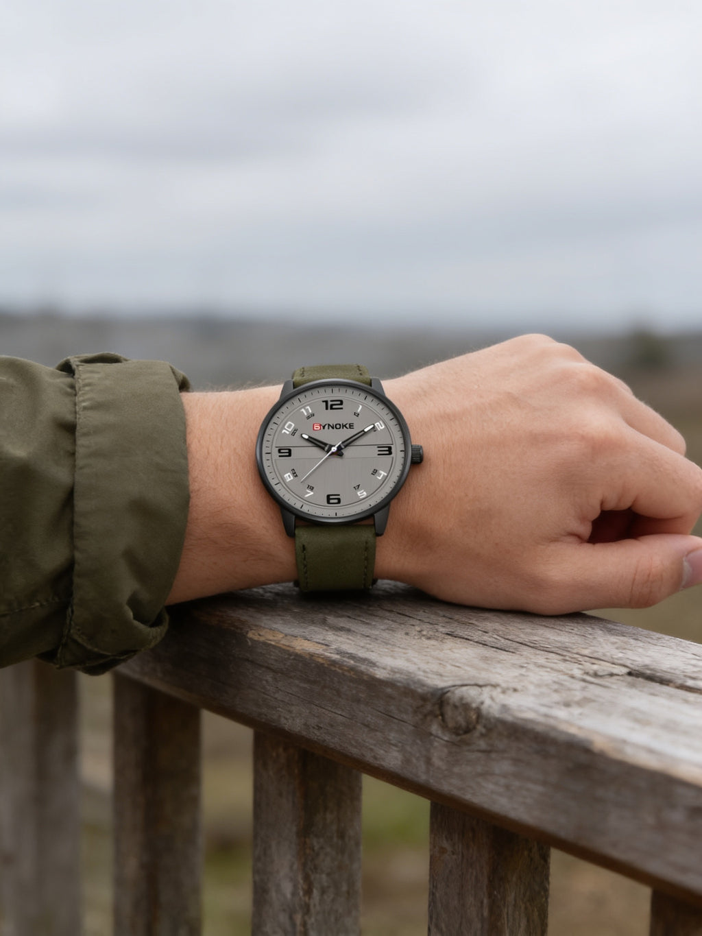 SYNOKE retro quartz watch with green leather strap worn outdoors