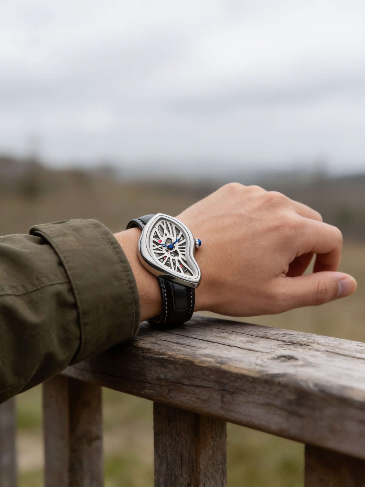 Eston Crash Melted Y2K watch in Silver Skeleton worn outdoors (X03C)