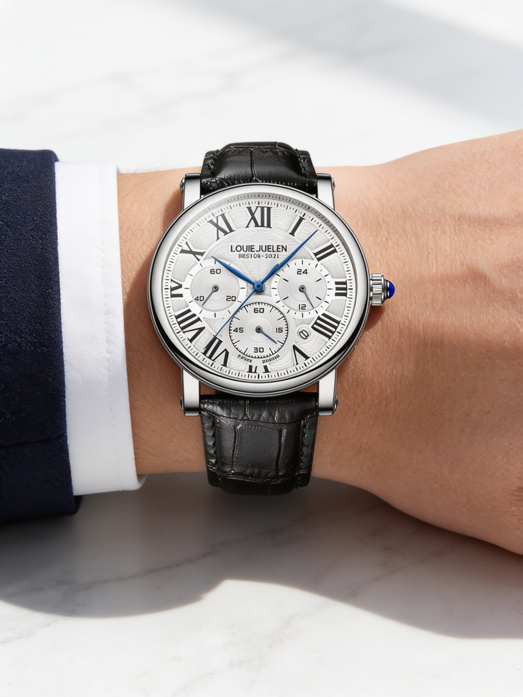 LOUIE JUELEN 40mm Roman-dial quartz watch, silver case and white dial, worn on marble