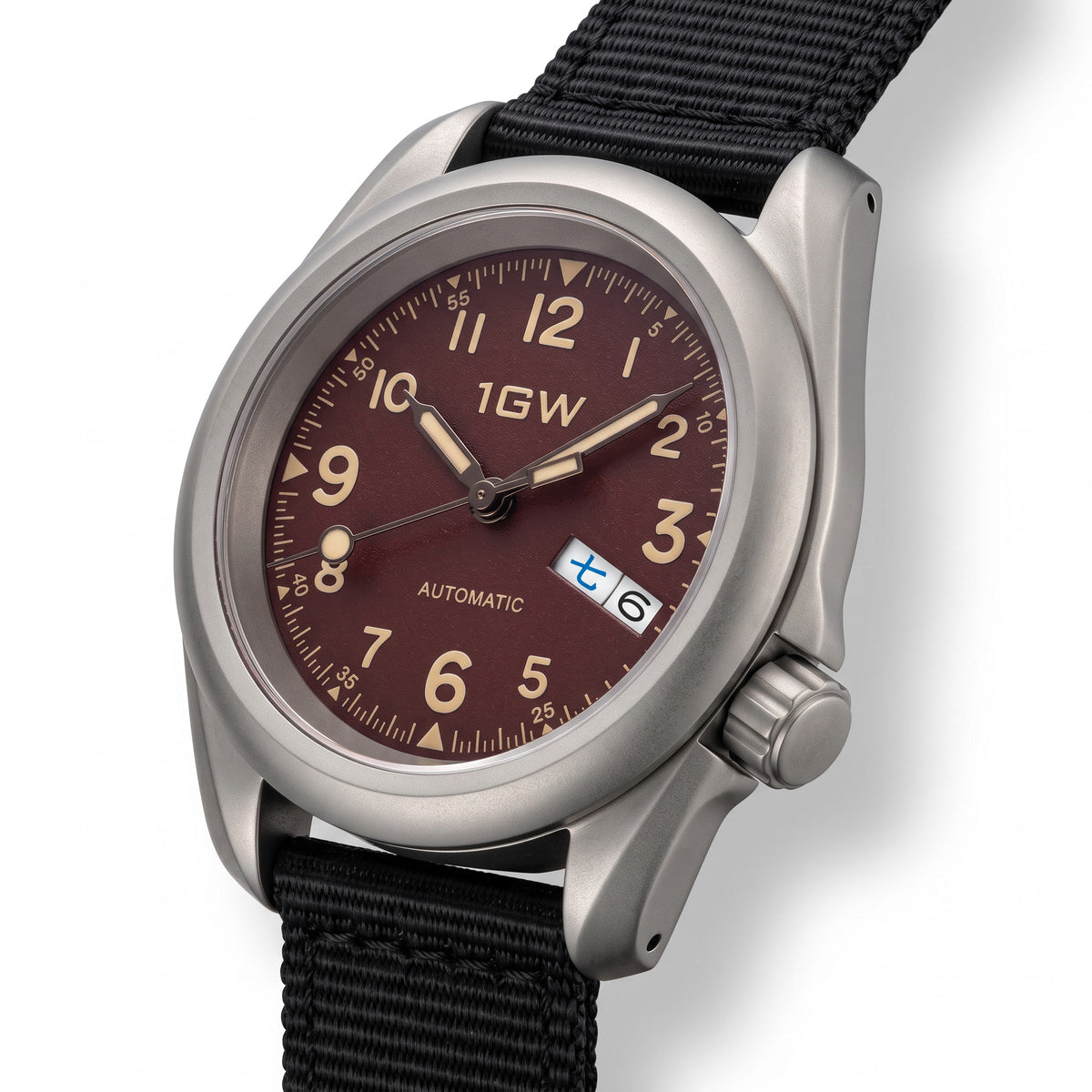1GW Burgundy Field Day-Date Titanium 40mm - three-quarter studio angle on white showing titanium case profile, crown and burgundy dial