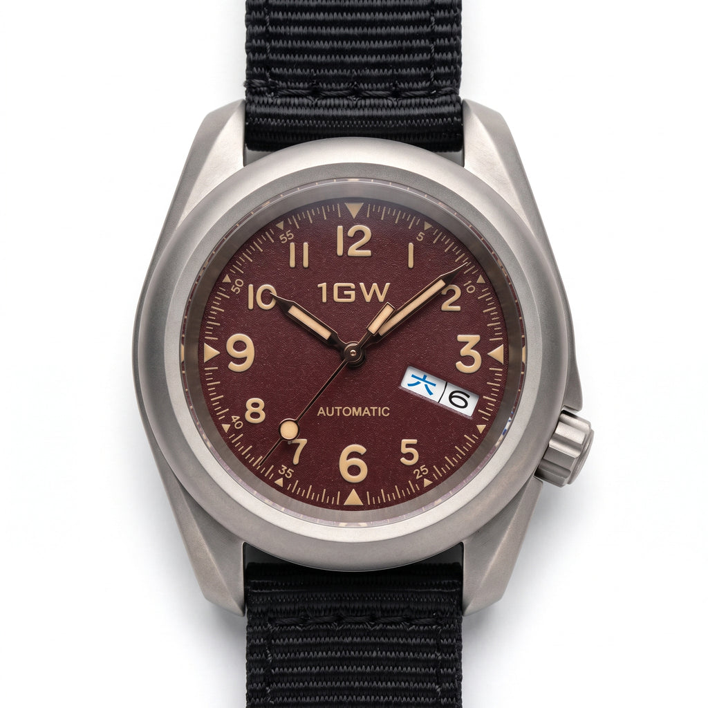 1GW Burgundy Field Day-Date Titanium 40mm - straight-on studio hero on white, burgundy textured dial, cream numerals, day-date at 3