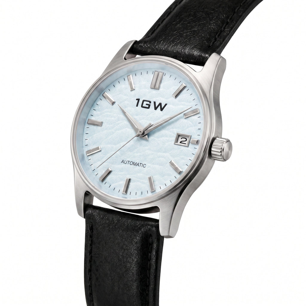 1GW Baby Blue Textured Automatic 39mm - three-quarter studio angle on white showing case profile and crown