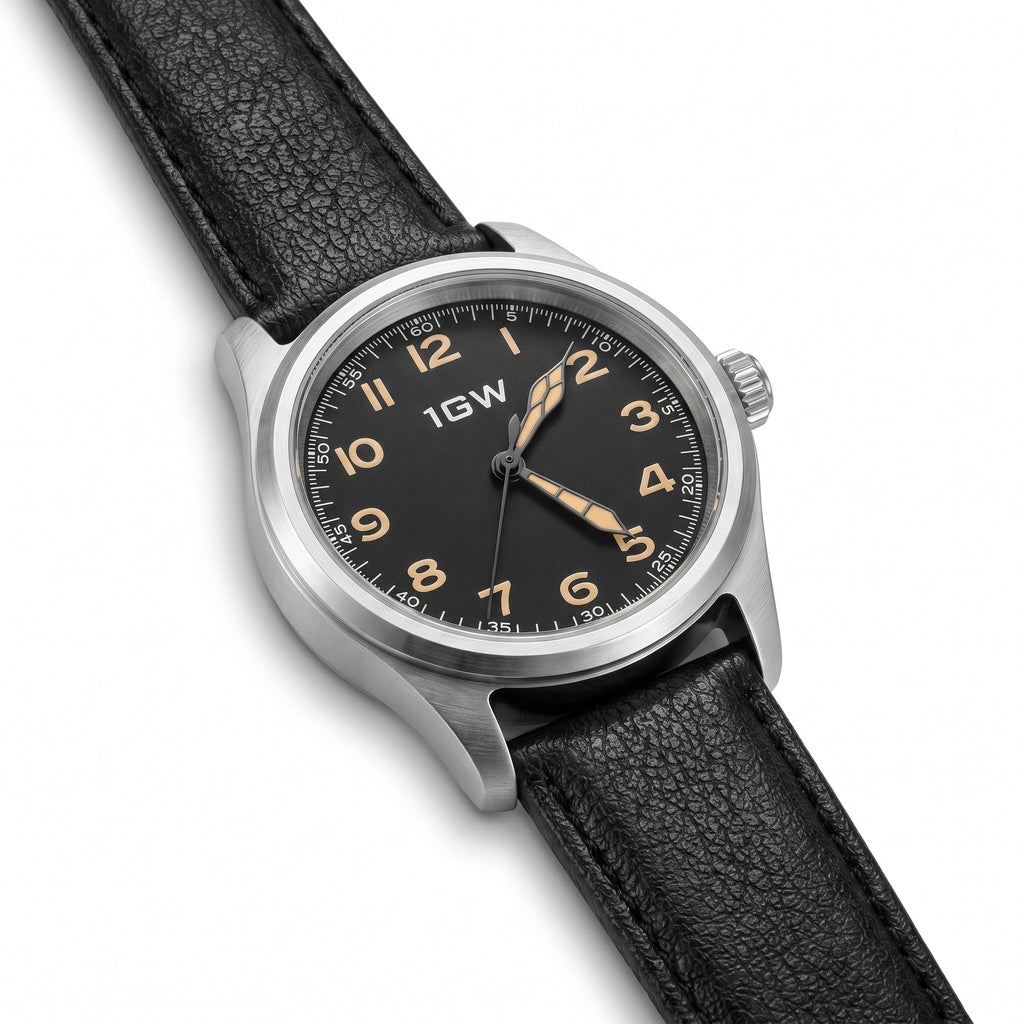 Black field automatic 36mm watch high three-quarter view on white