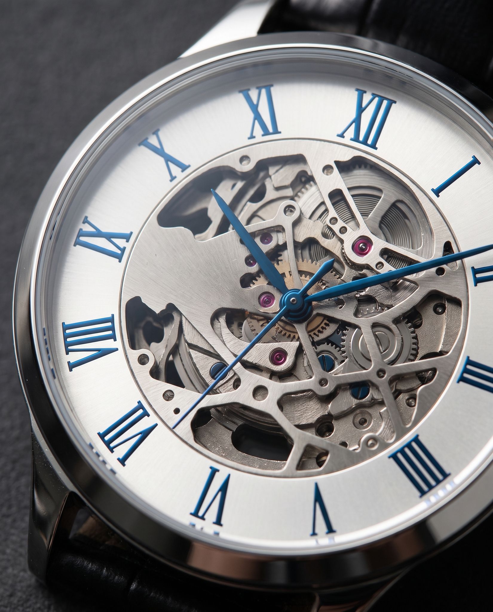 Carnival IW.652G skeleton dial macro showing the exposed movement and blue Roman numerals