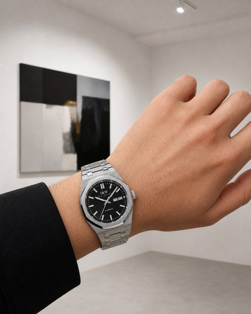 Carnival black-dial integrated-bracelet automatic watch on wrist in an art gallery