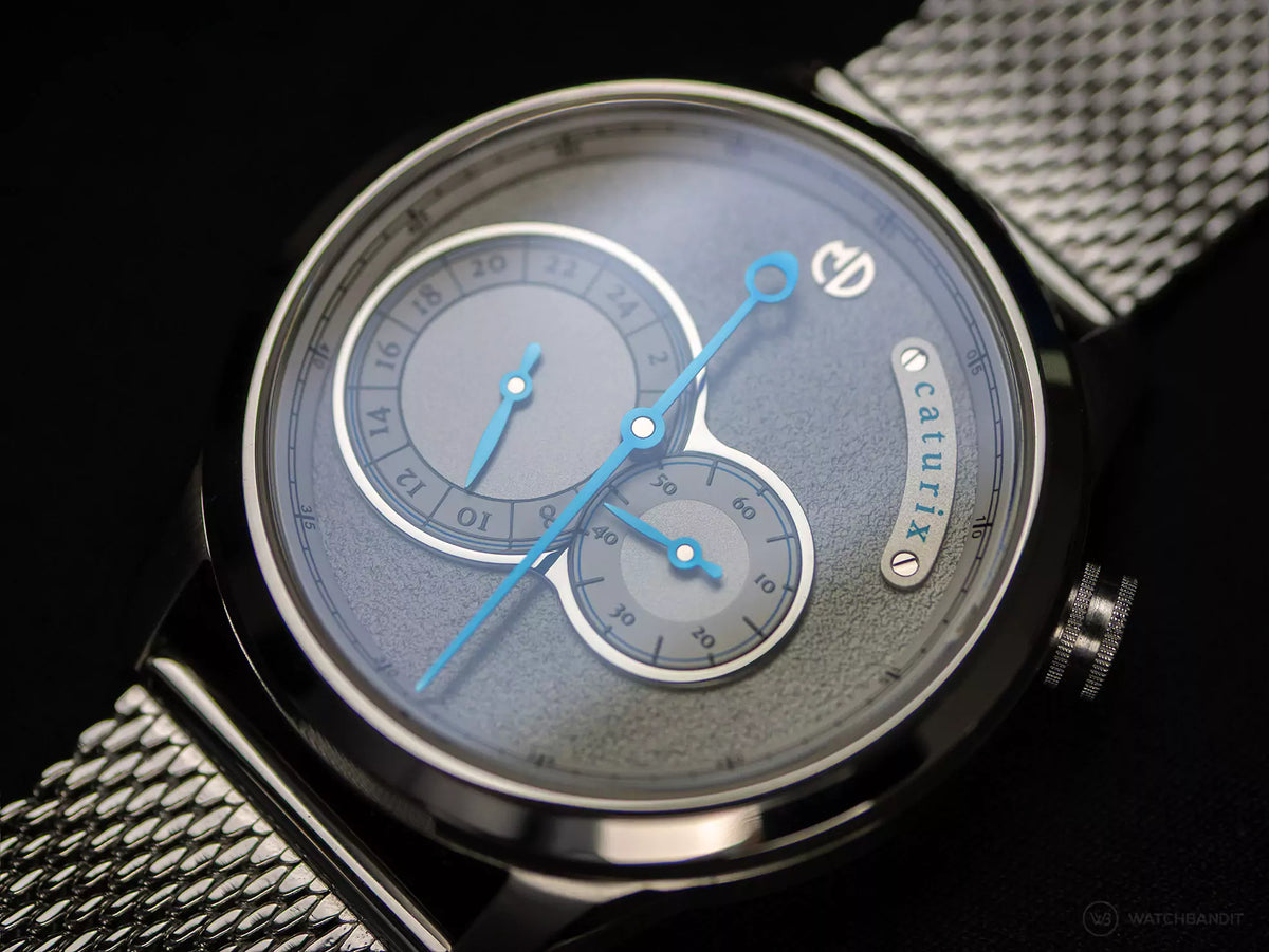 Close-up of the Caturix frosted grey dial and blued hands