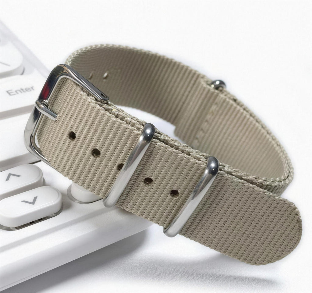 Khaki woven nylon pass-through watch strap with brushed steel keepers and pin buckle