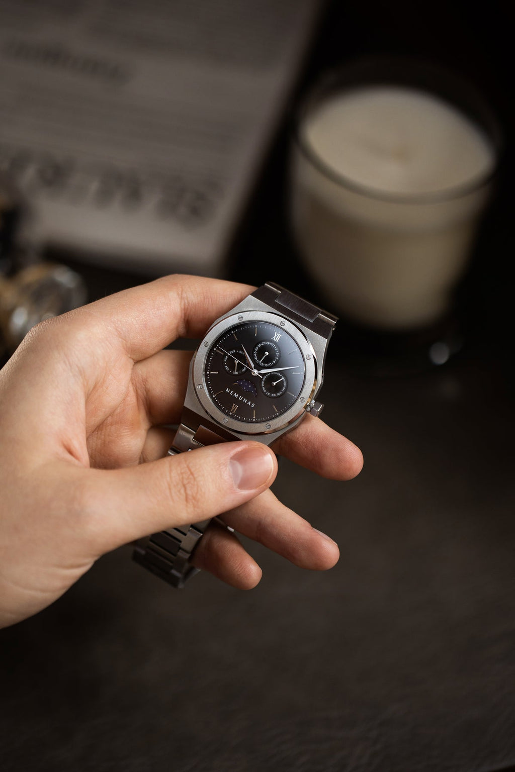 NEMUNAS Perkunas black and silver watch dial close-up