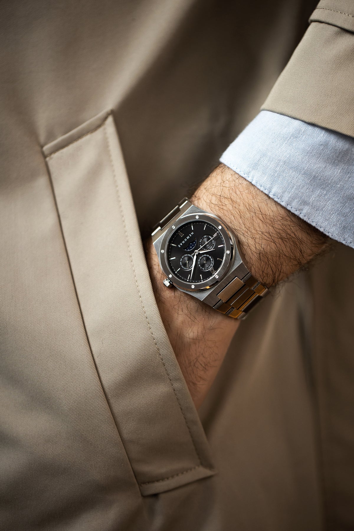 NEMUNAS Perkunas black and silver watch with tan jacket