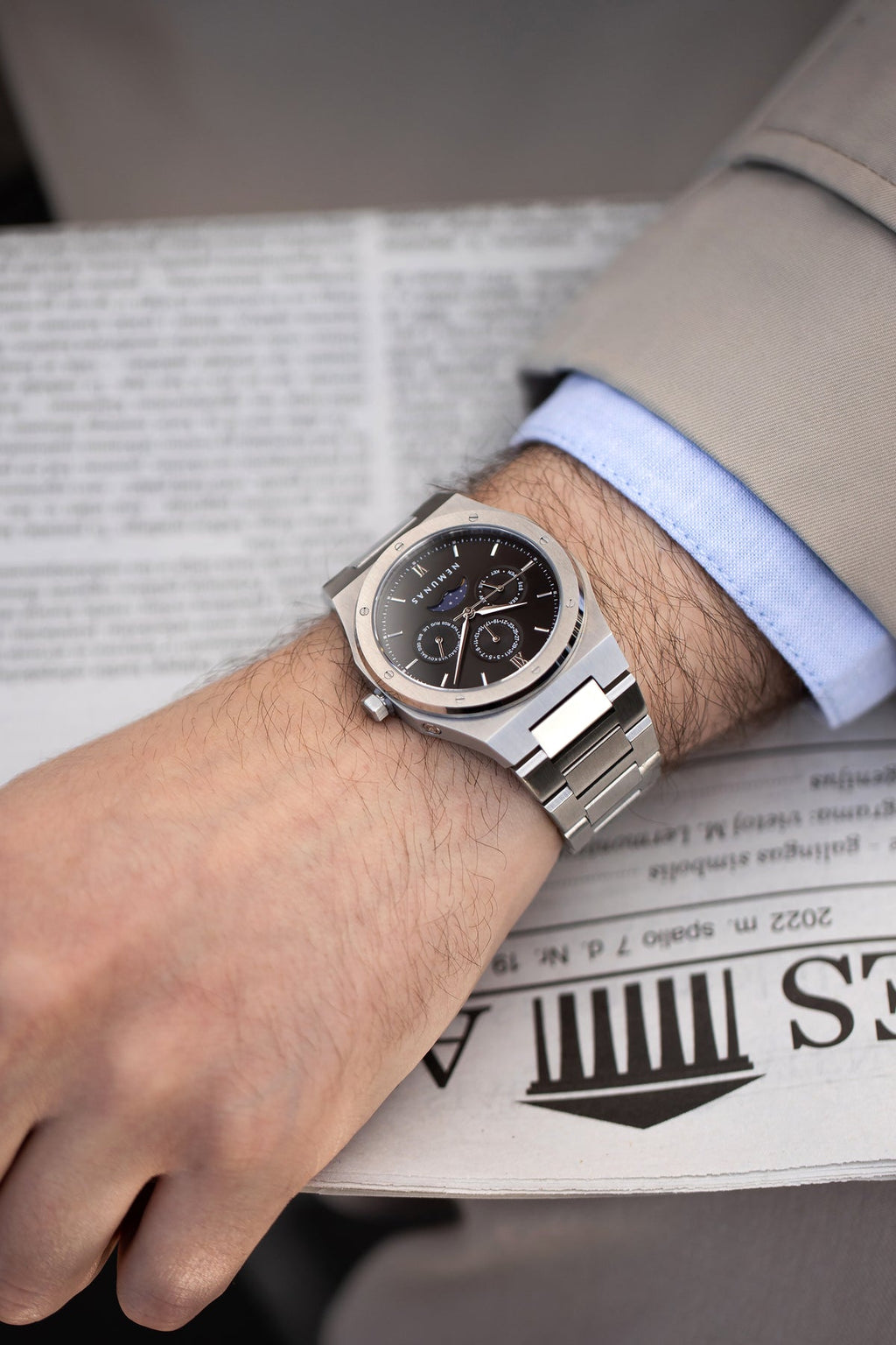 NEMUNAS Perkunas black and silver watch on wrist close-up