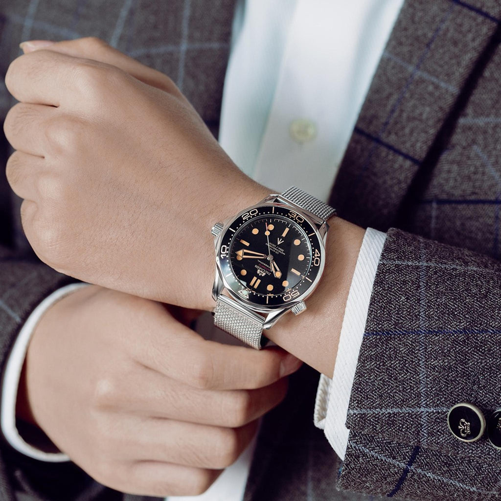 Paulareis silver automatic watch with steel mesh bracelet worn on wrist