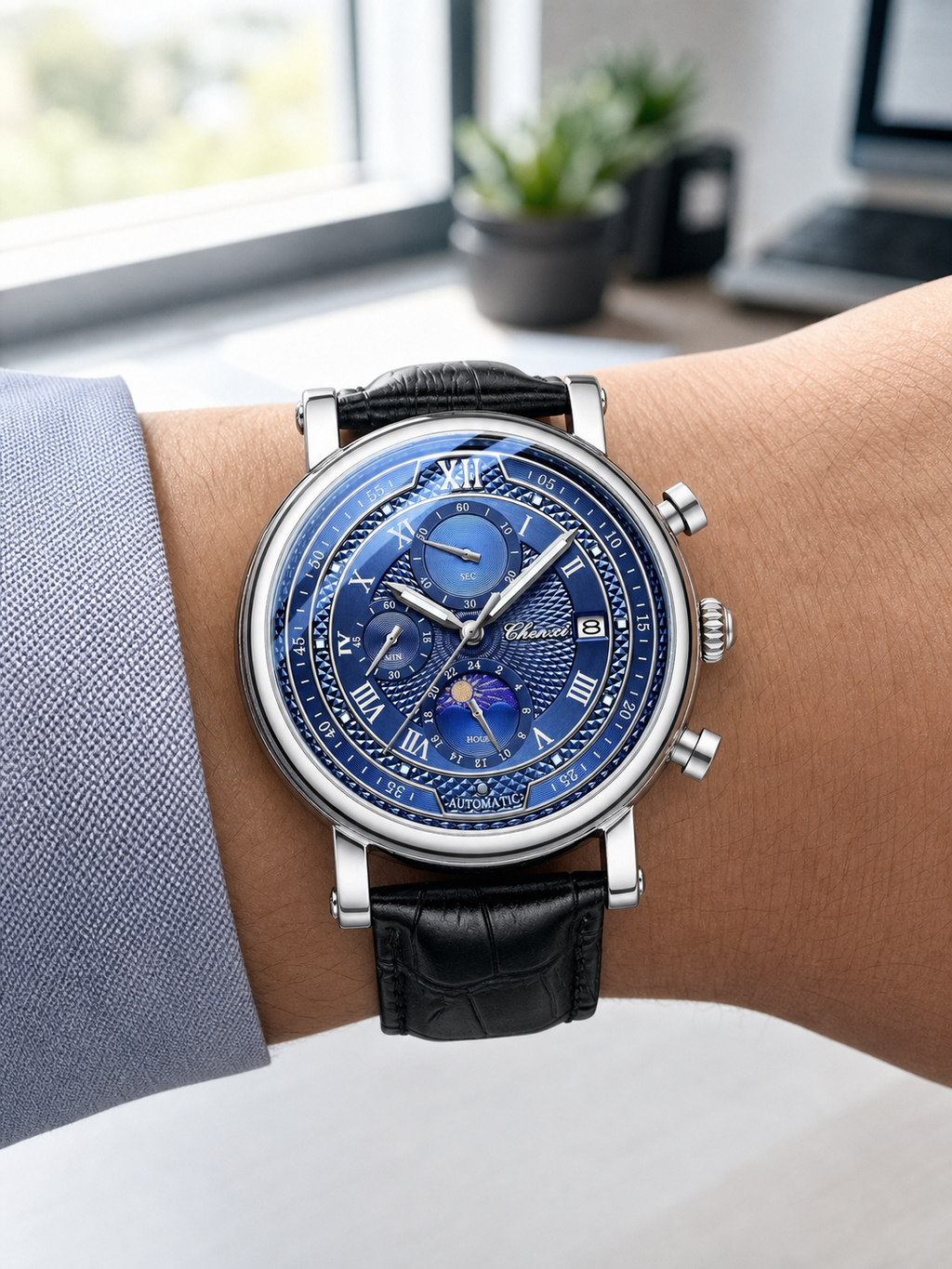 1GW 44mm Blue layered Roman-dial quartz watch worn at a bright workspace