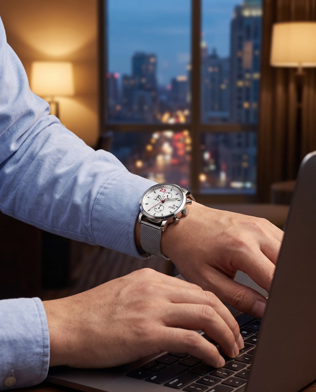 Man in a blue oxford shirt wearing the SINOBI S9765G white chronograph while typing on a laptop