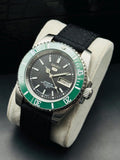Seller-refurbished Seiko 5 Sports automatic with black dial, green bezel and black nylon strap