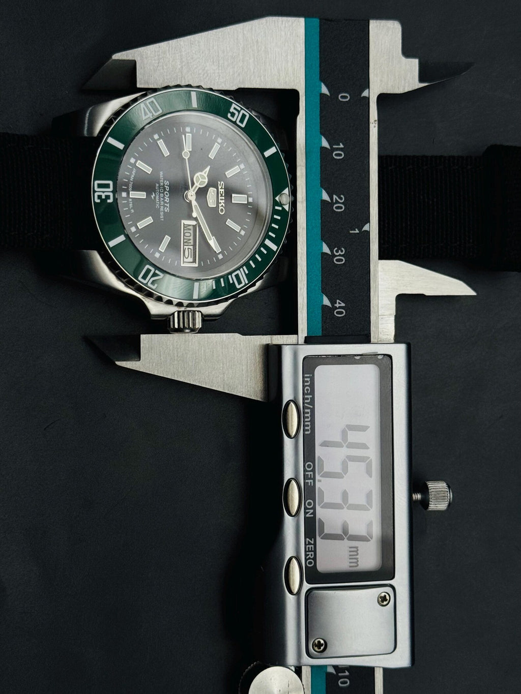 Seller measurement of Seiko 5 Sports case at approximately 45.5 mm