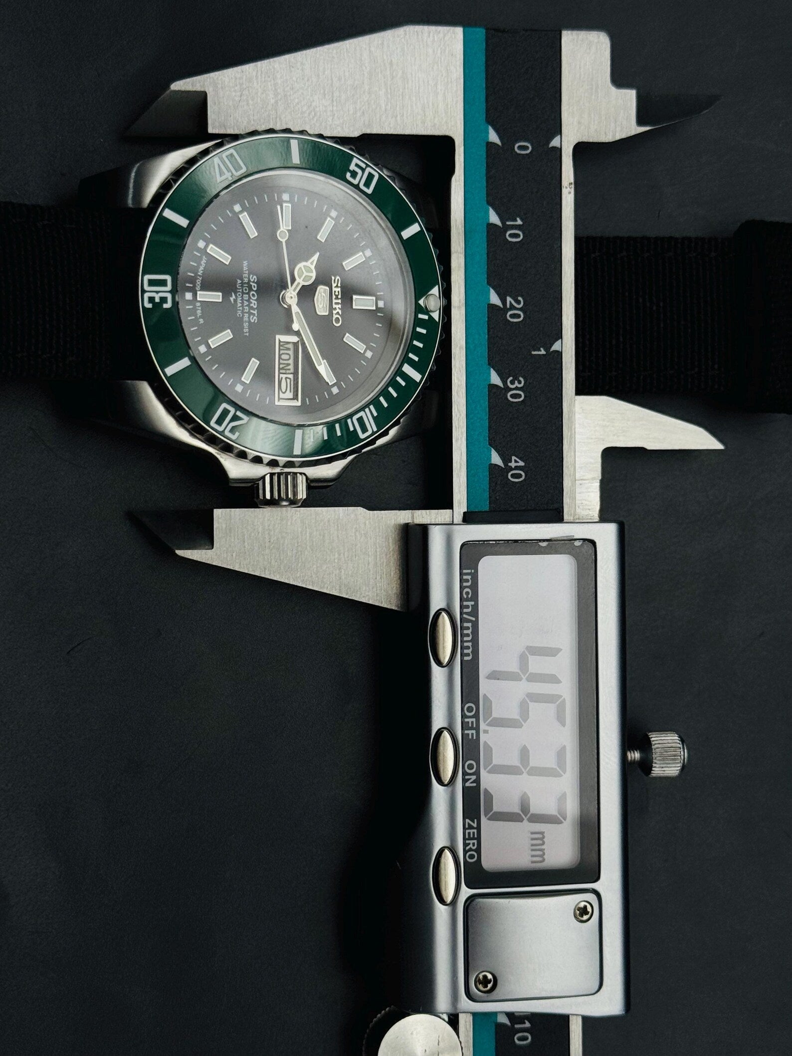 Seller measurement of Seiko 5 Sports case at approximately 45.5 mm