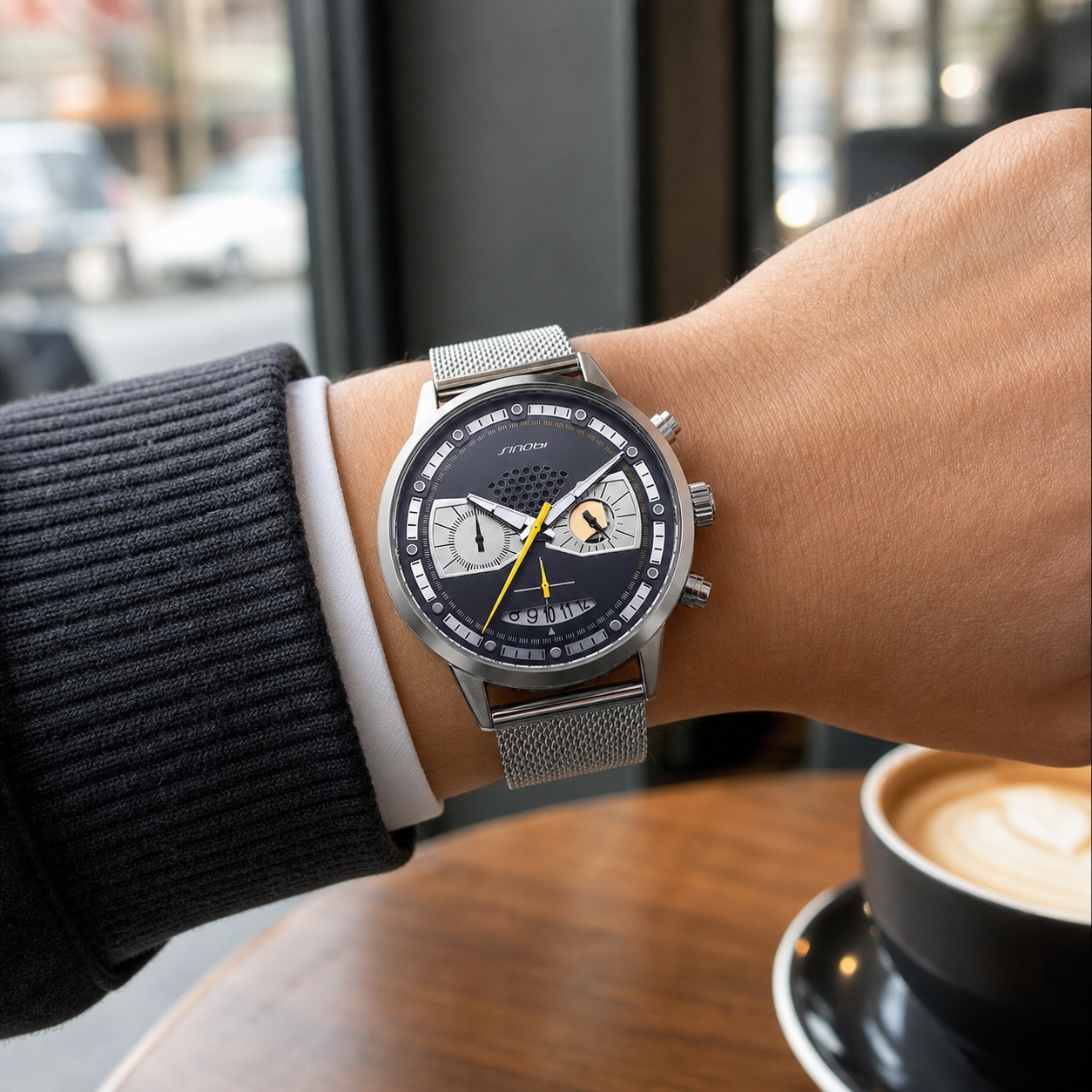SINOBI S9814G silver steel-mesh watch worn at a city cafe
