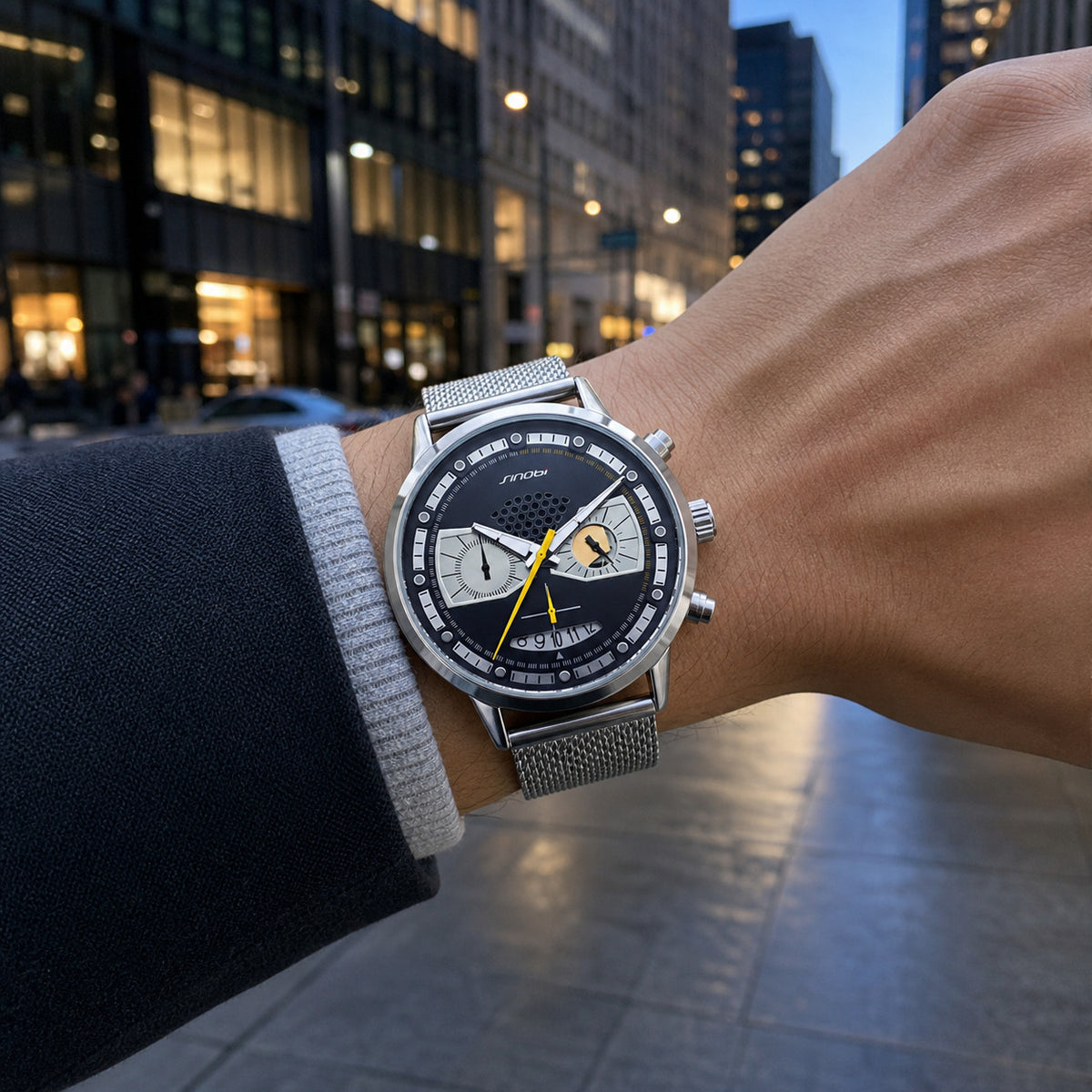 SINOBI S9814G silver steel-mesh watch worn downtown at blue hour