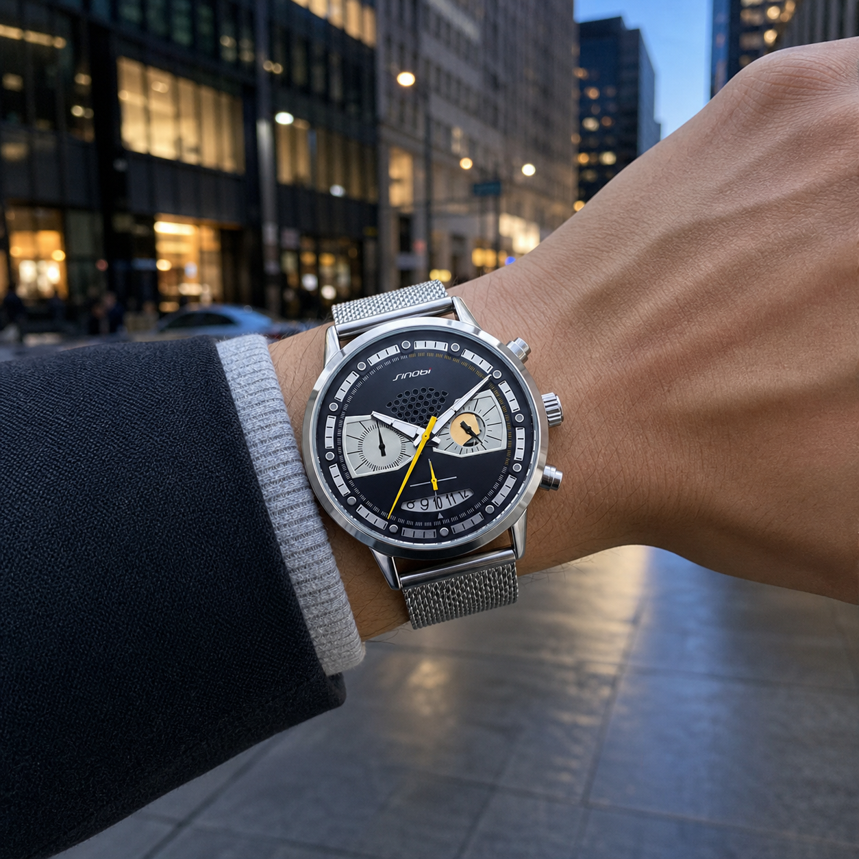SINOBI S9814G silver steel-mesh watch worn downtown at blue hour