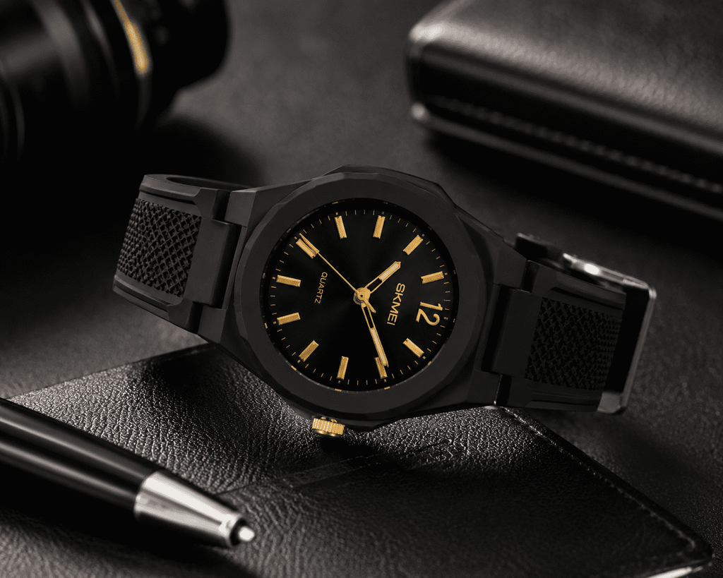 SKMEI 1717 quartz watch, black case with black dial and gold hands, resting on dark leather
