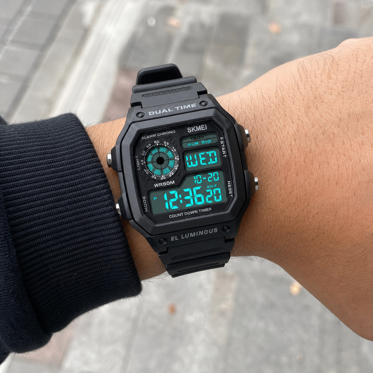 SKMEI 1299 Black case and black band digital sport watch worn on wrist
