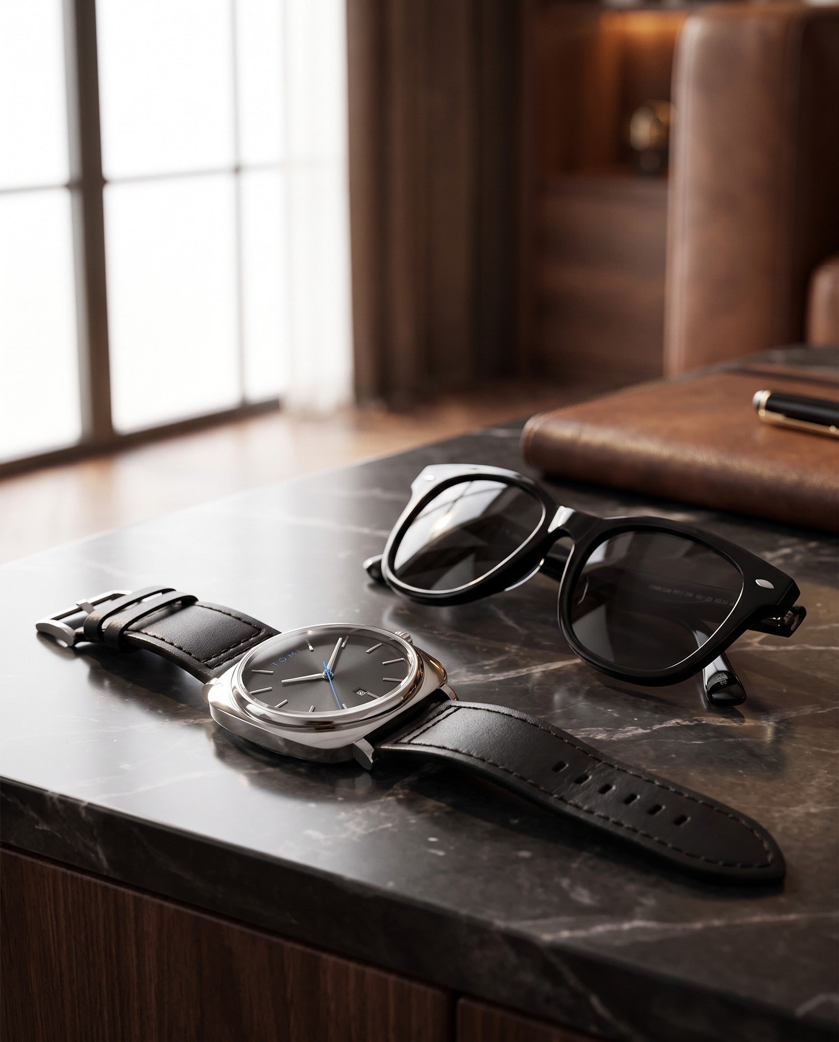 Watch and sunglasses gift set on marble