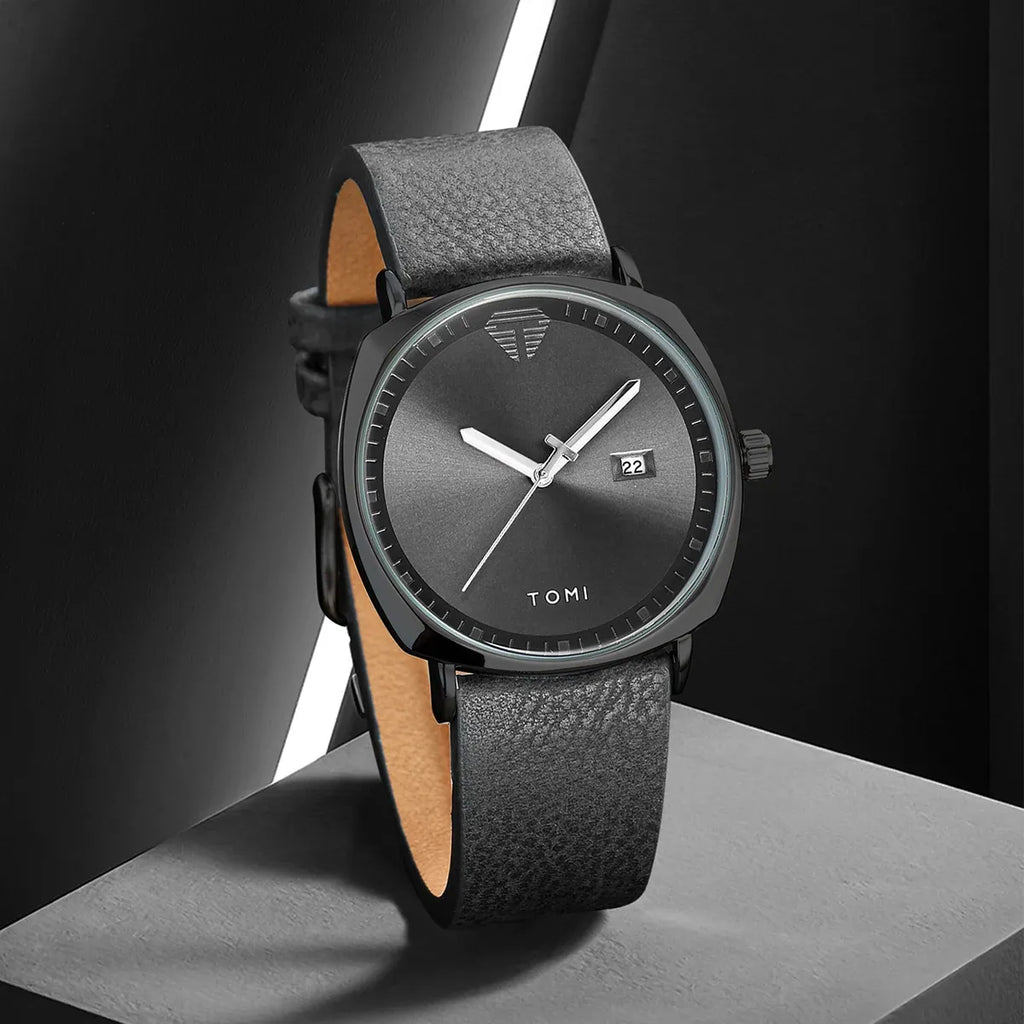 TOMI minimalist calendar quartz watch with black case, black dial, and black leather strap