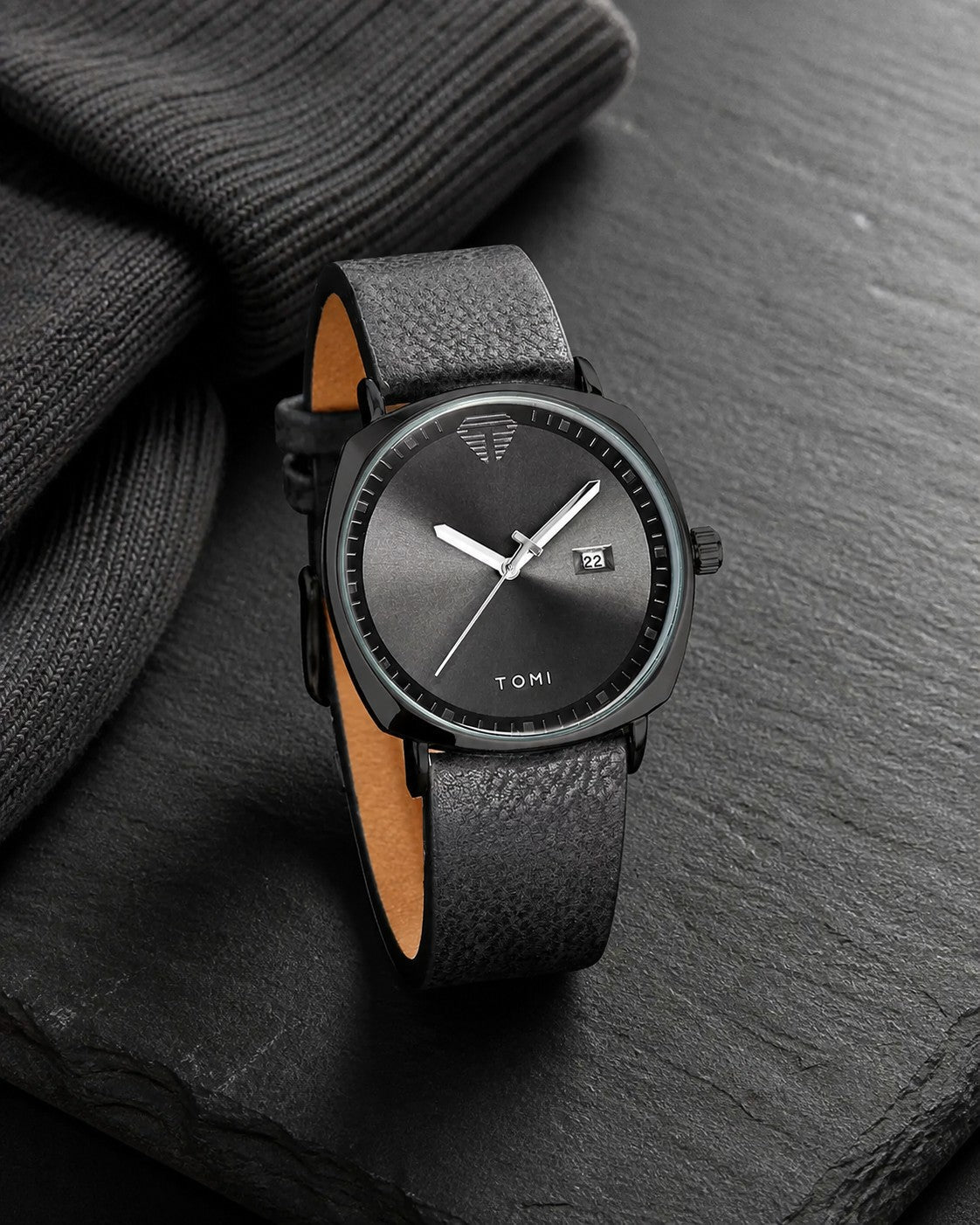 TOMI black dial and black case quartz watch with black leather strap on charcoal stone