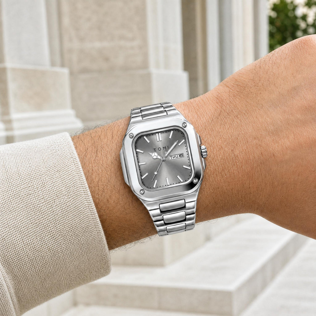 TOMI T306 silver square steel quartz watch with grey dial worn on wrist