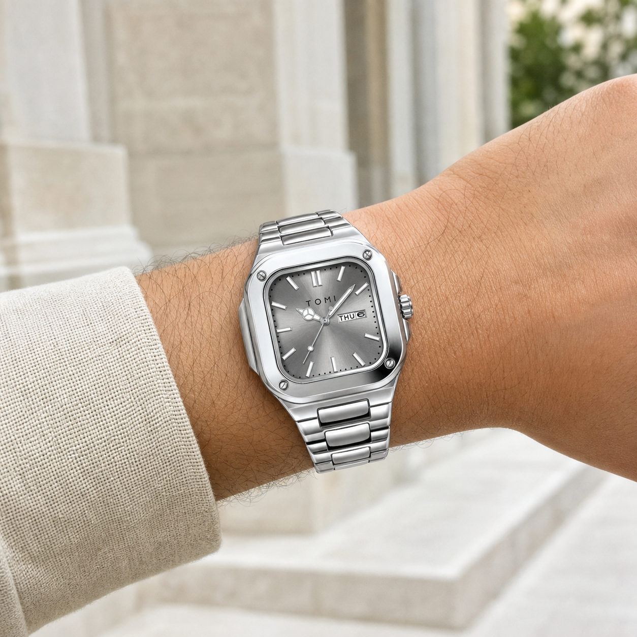 TOMI T306 silver square steel quartz watch with grey dial worn on wrist