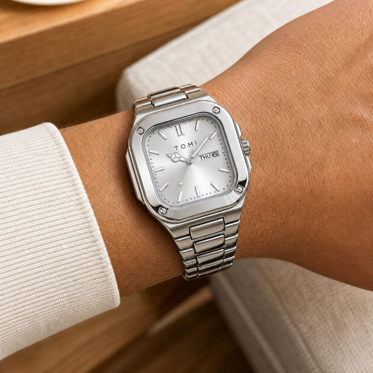 TOMI T306 silver square steel quartz watch with silver dial worn on wrist