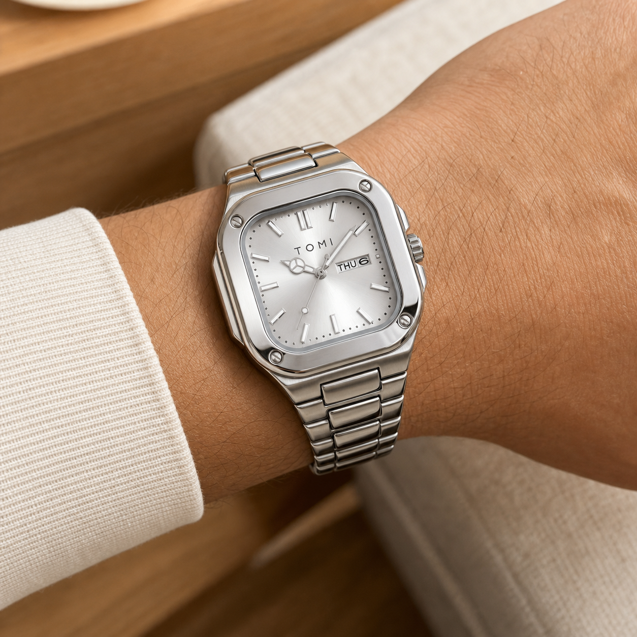 TOMI T306 silver square steel quartz watch with silver dial worn on wrist