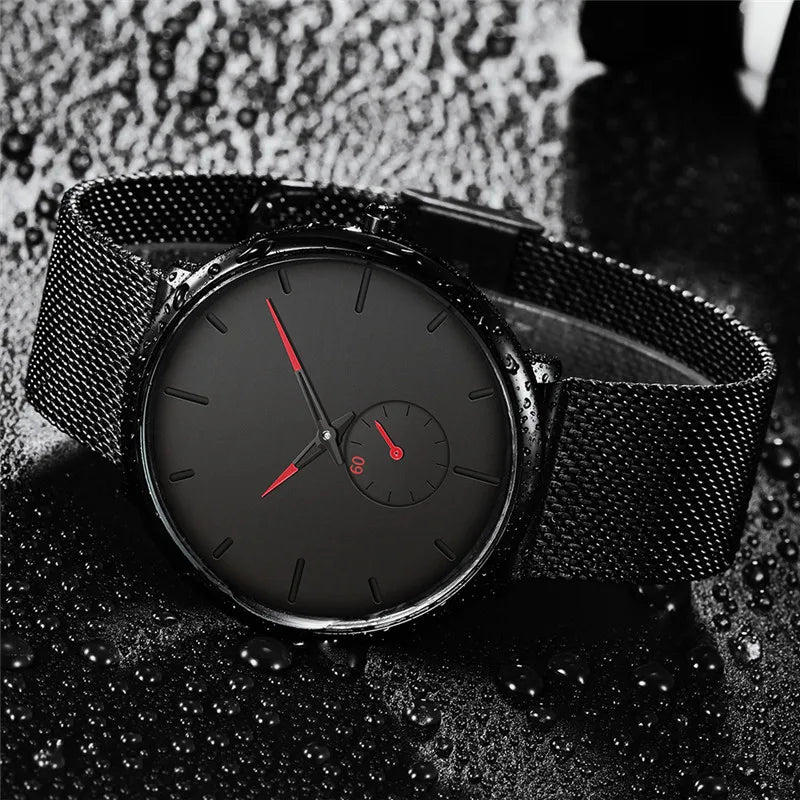 WINDOWSTIME mesh watch worn on wrist, wet dramatic shot, red accents